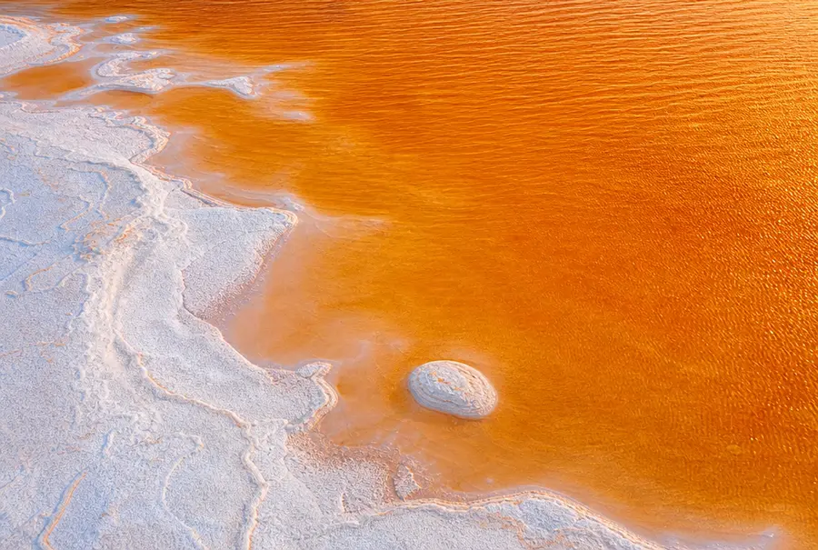 Golden-orange salt lake coloured naturally by Dunaliella salina microalgae