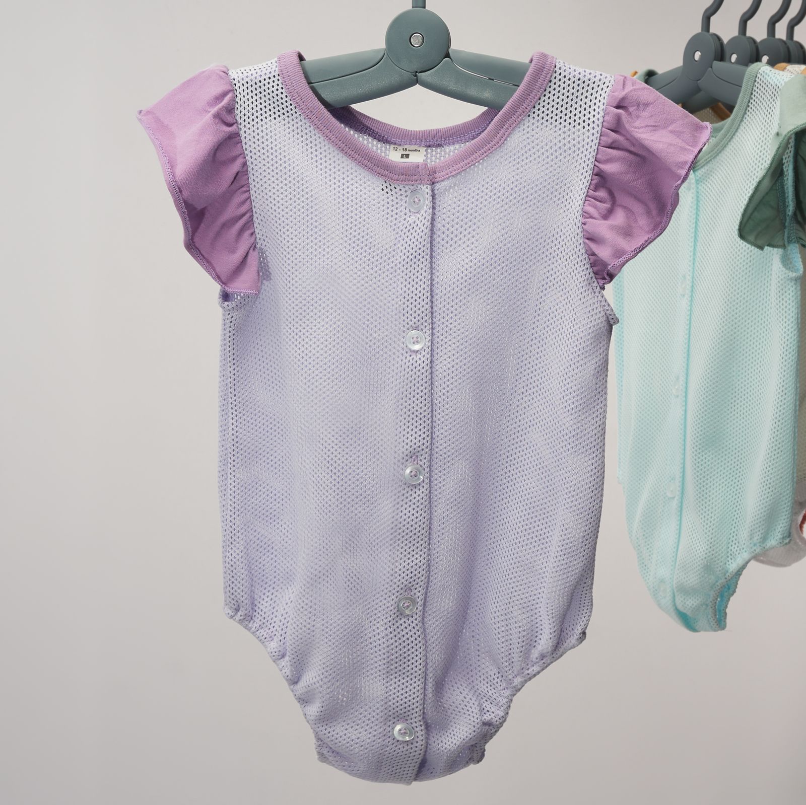 girl-eyelet-rompers-with-ruffled-sleeve-lavender